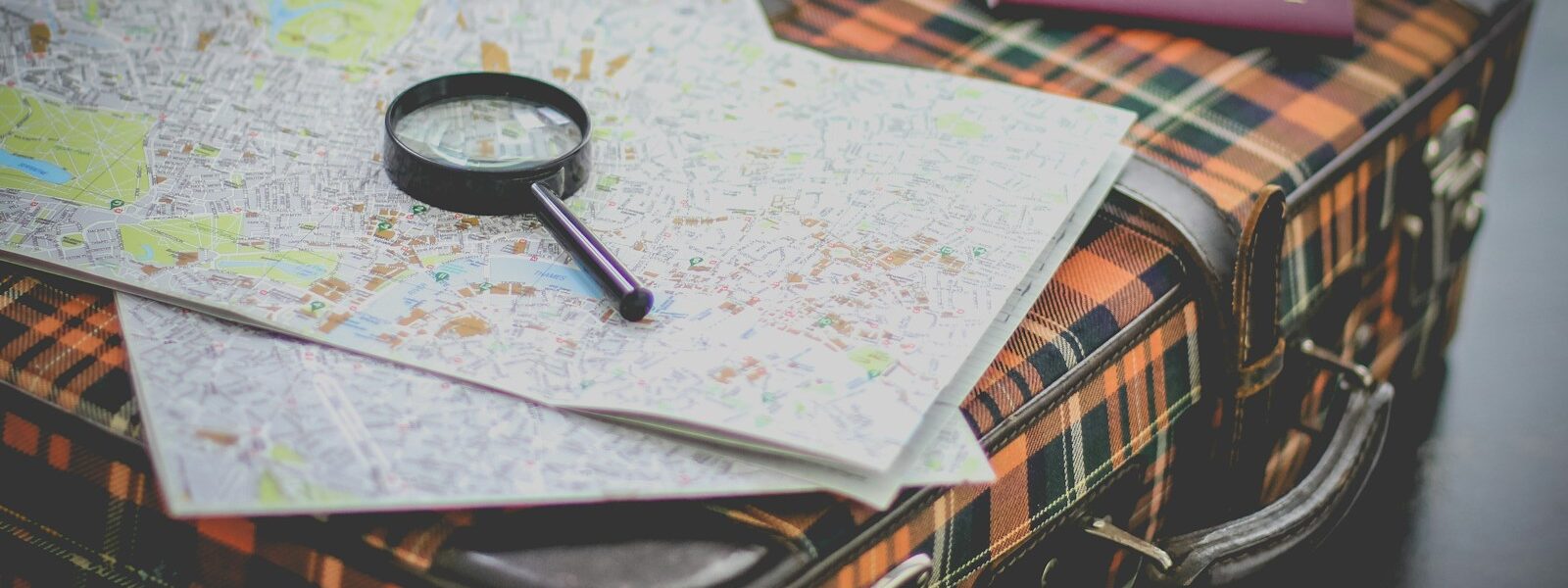 black magnifying glass on map
