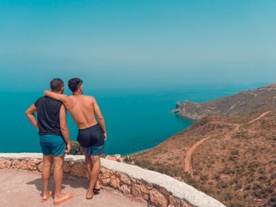 חופשה במבצע Two men enjoying a scenic view over the coastline of Chefchaouen, Morocco.